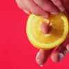 Inserting a finger into a lemon