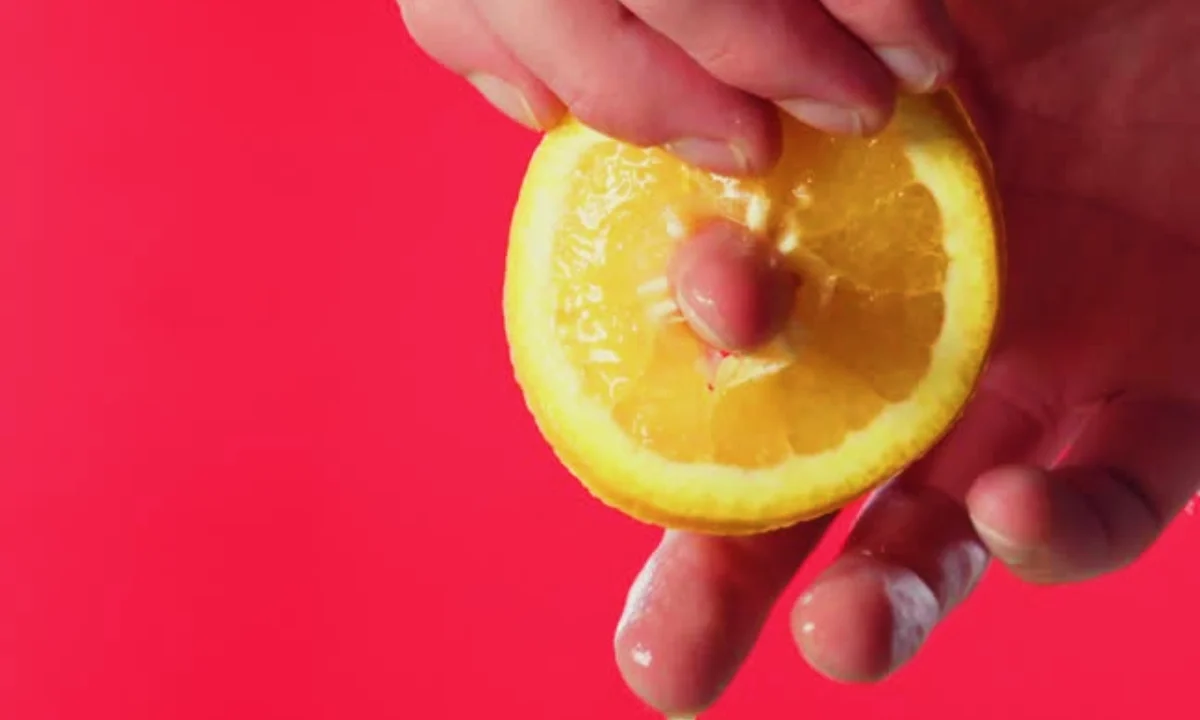 Inserting a finger into a lemon