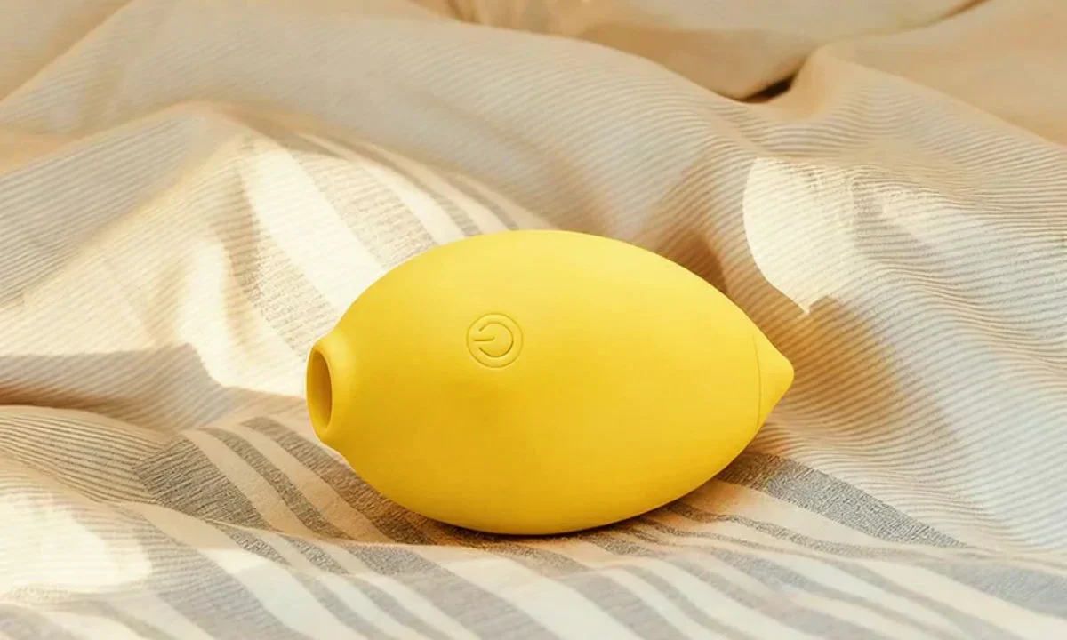 Cute lemon vibrator on the bed